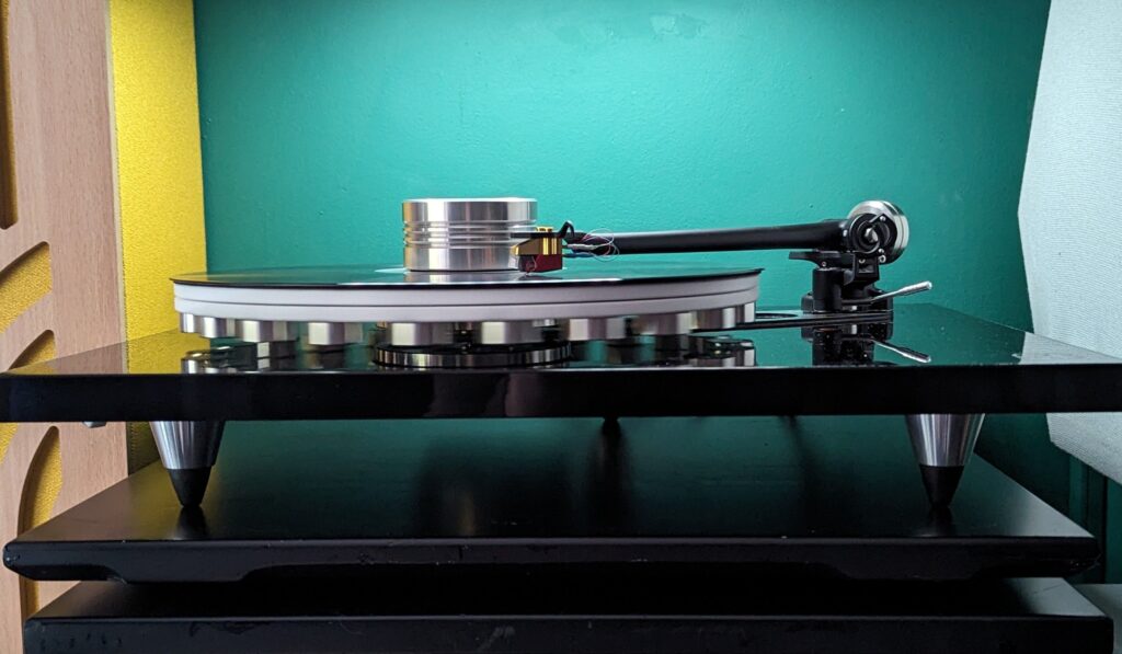 Sleek turntable on display, showcasing modern home audio setup with vibrant decor.